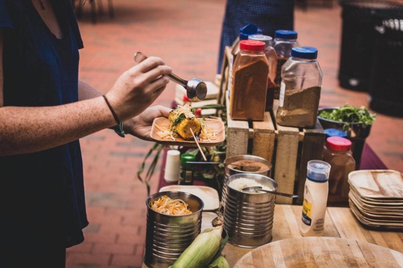 student getting food at table